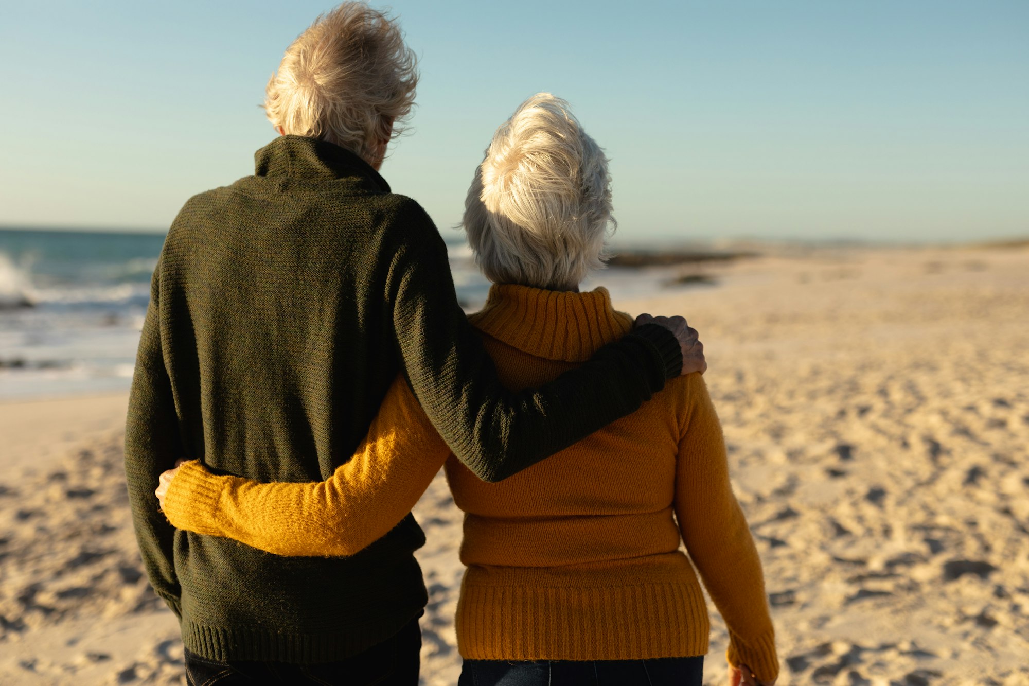 Old couple in love at the beach